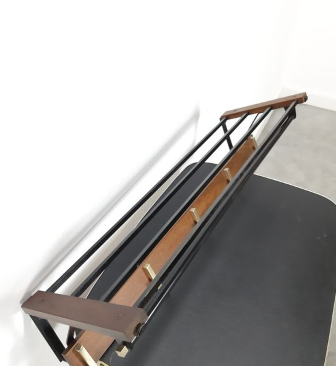 Vintage wooden wall coat rack with hooks and brass shelf