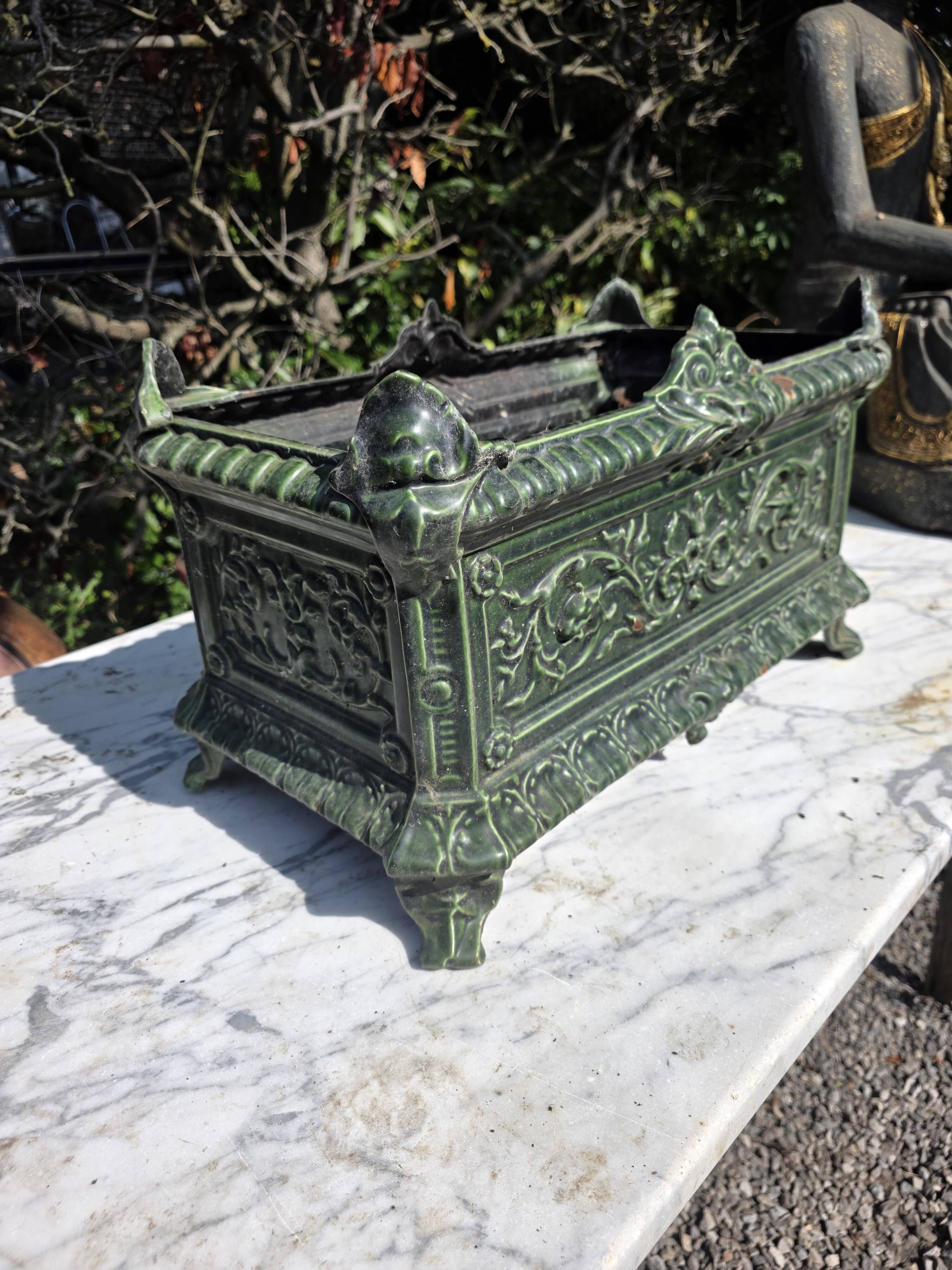 Antique enamelled cast iron planter in the Napoleon III style.