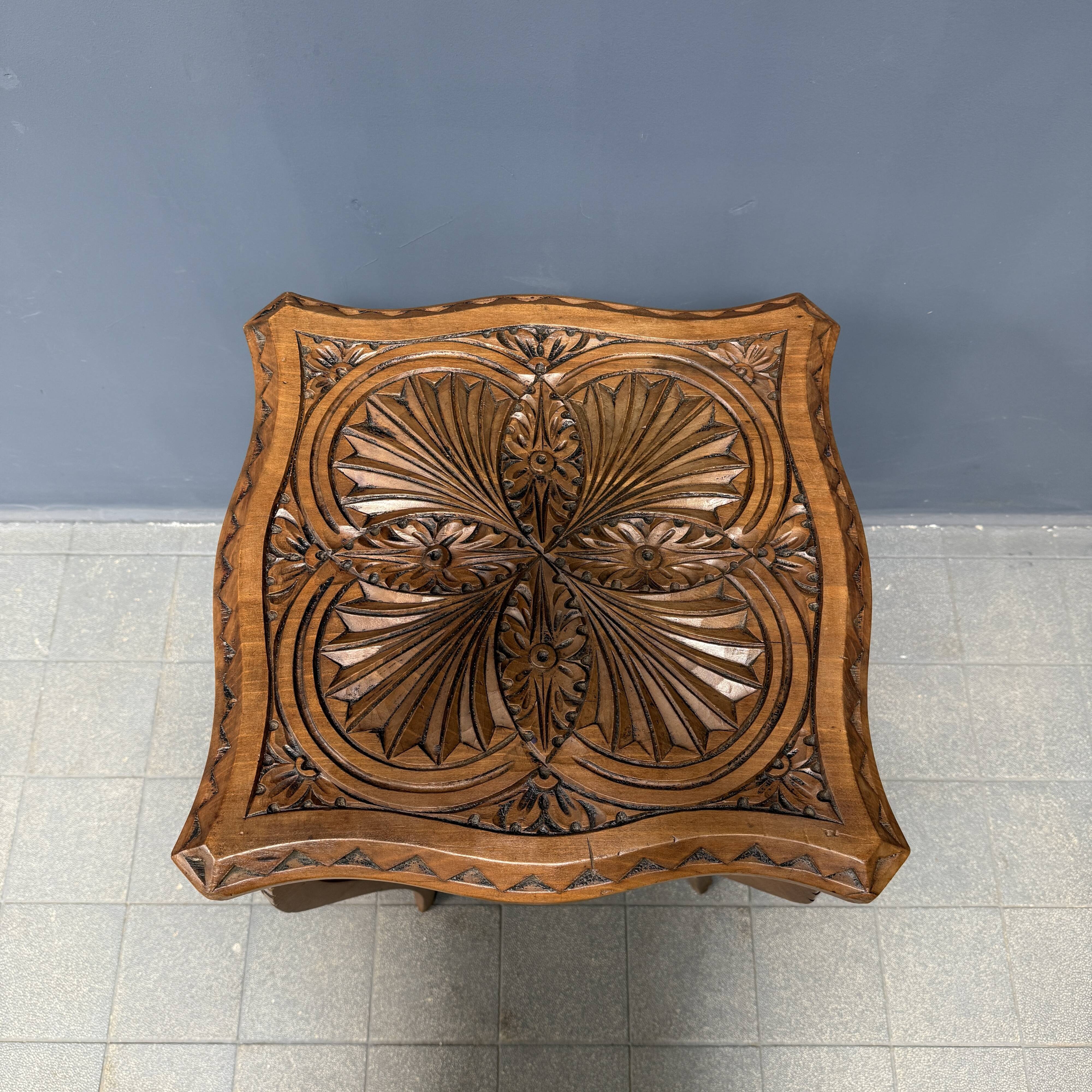 Graceful antique carved wooden side table