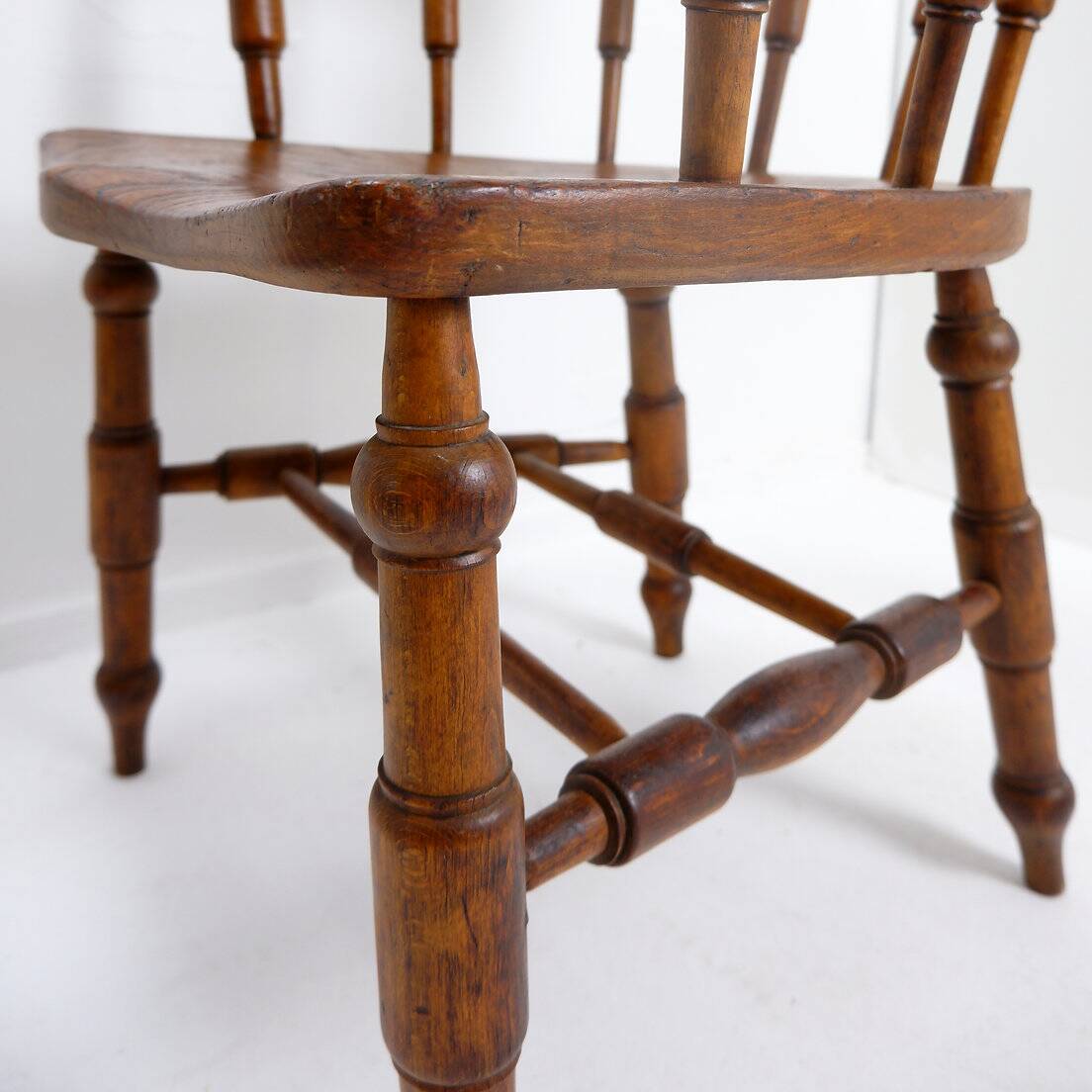 Elm armchair with curved back