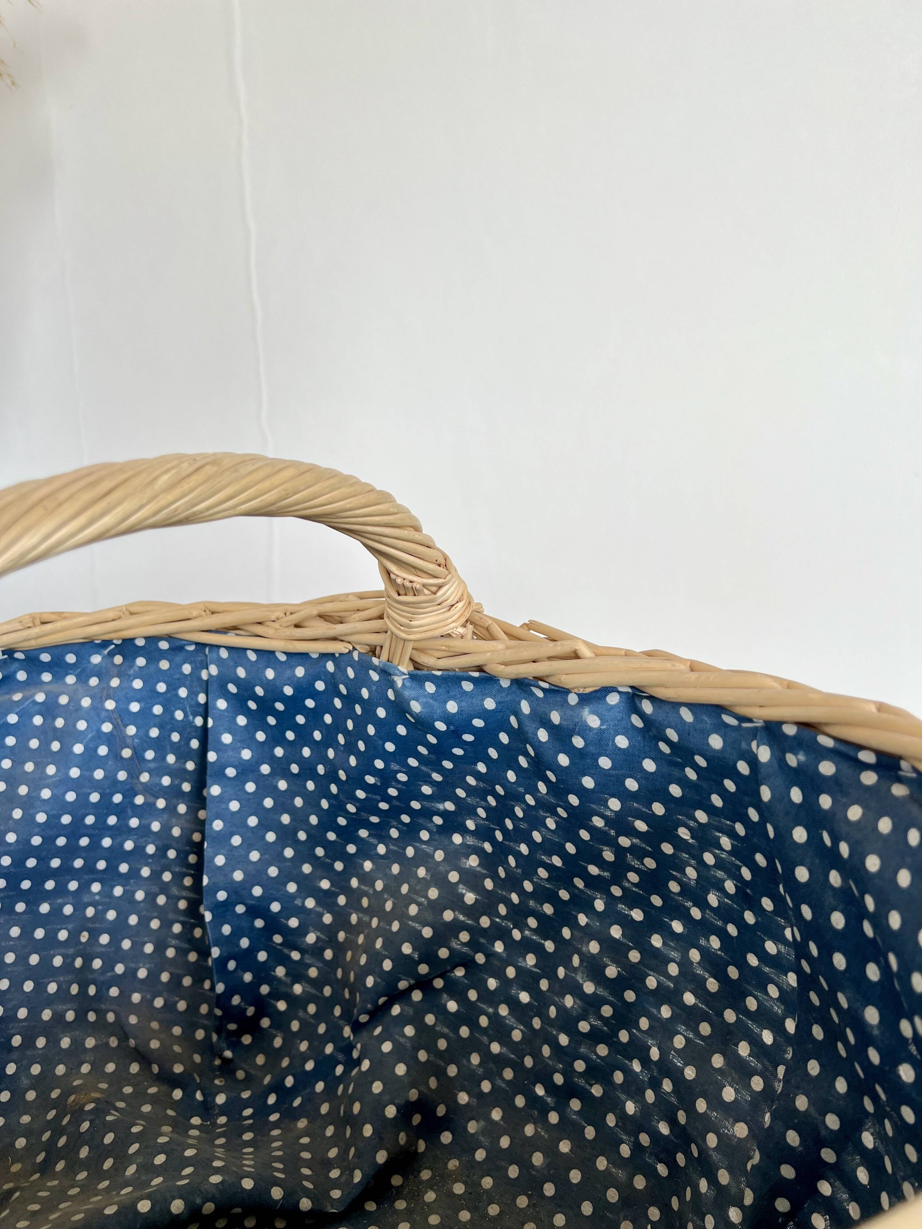 Large vintage wicker basket and blue lining with white polka dots