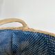 Large vintage wicker basket and blue lining with white polka dots