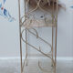 Side table with a golden magazine holder