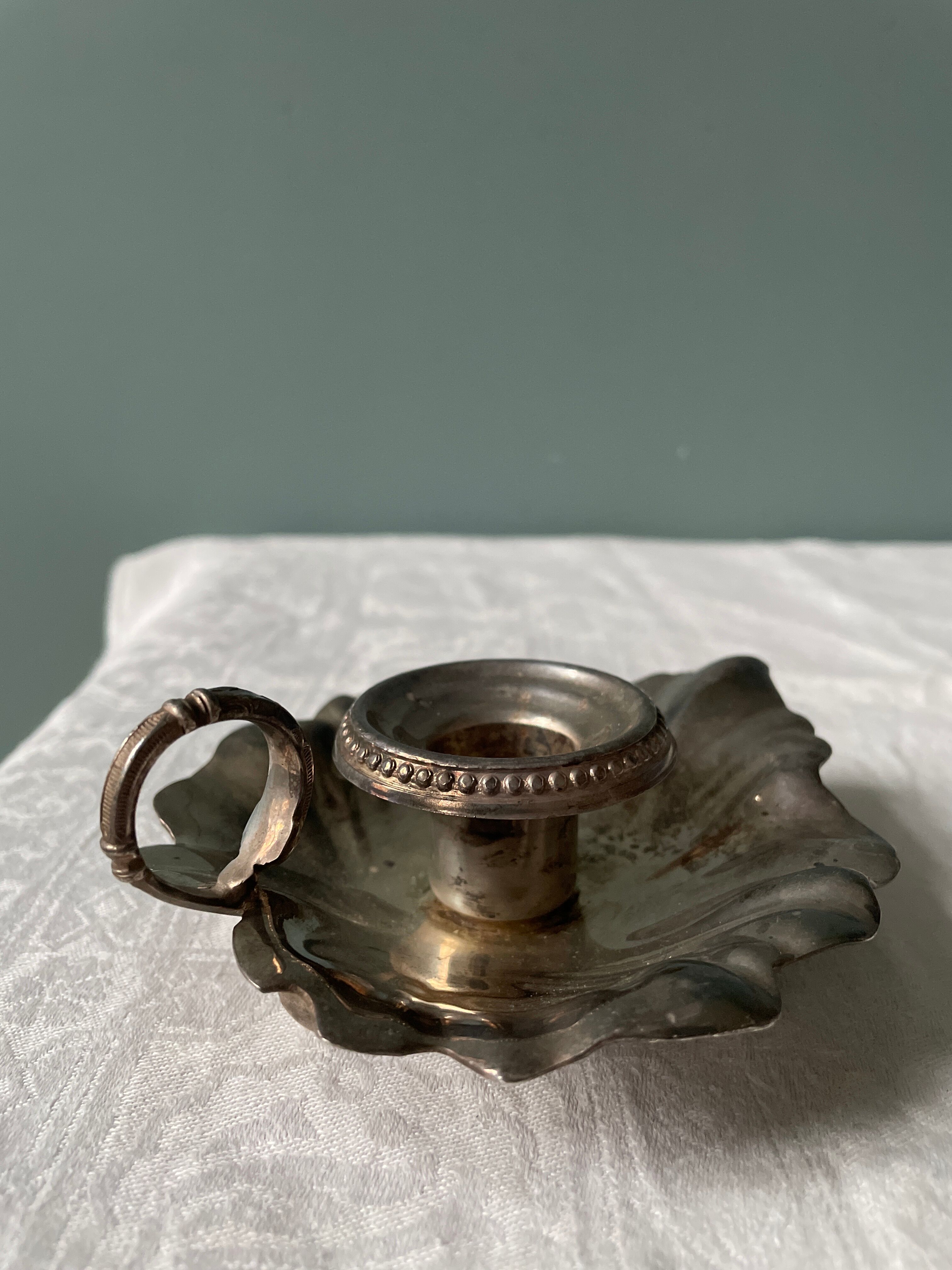 Old leaf-shaped hand candle holder, mid-twentieth