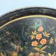 Round plateau, 19th century, painted black with fruit and grape decoration (49 cm)