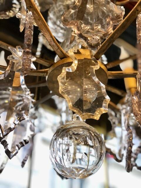 Large chandelier with tassels and old daggers