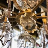 Large chandelier with tassels and old daggers