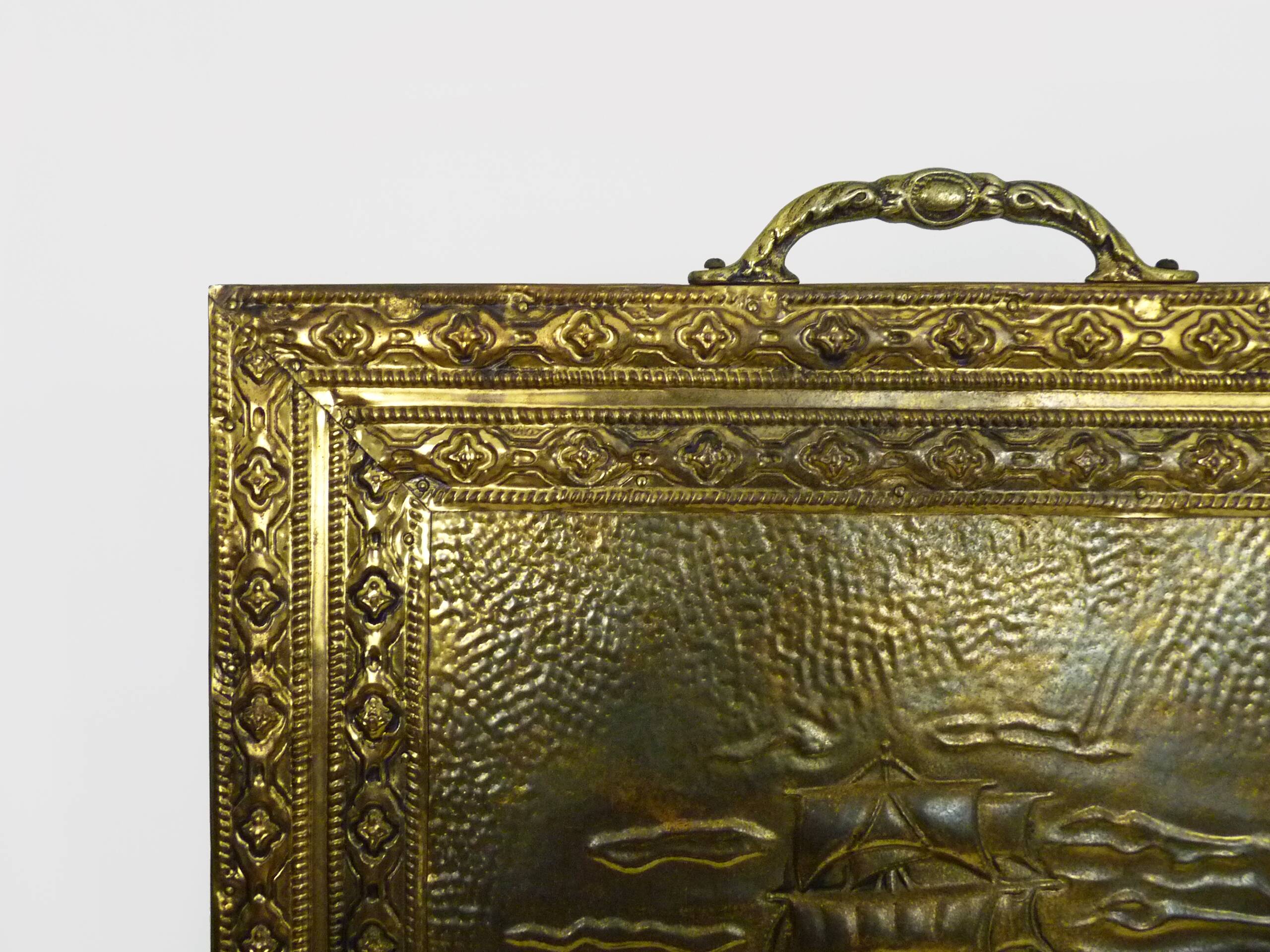 Fireplace screen in repoussé brass with a sailing boat. 1960s.