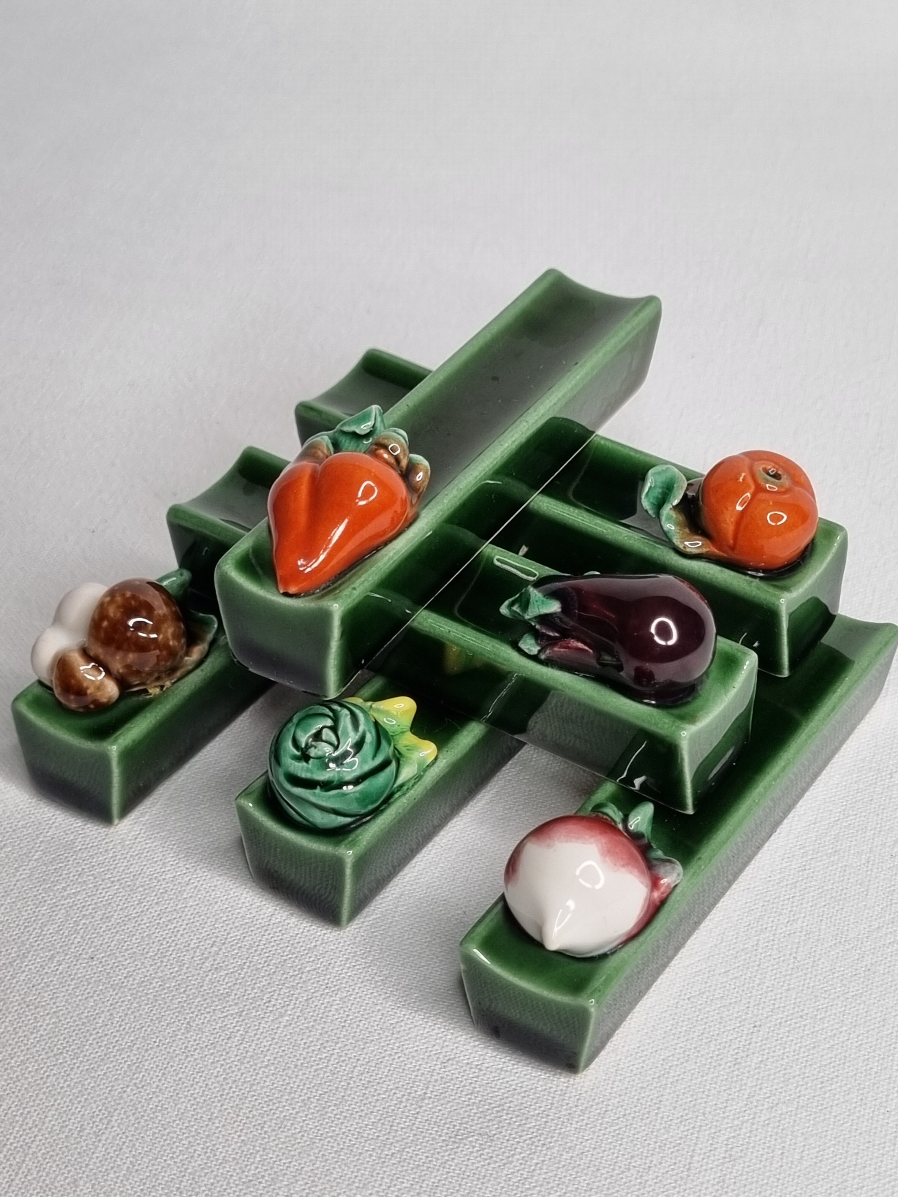 Set of six enamelled ceramic knife holders decorated with vegetables from the sun