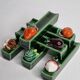 Set of six enamelled ceramic knife holders decorated with vegetables from the sun
