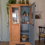 Old glass-fronted wooden library – blue interior
