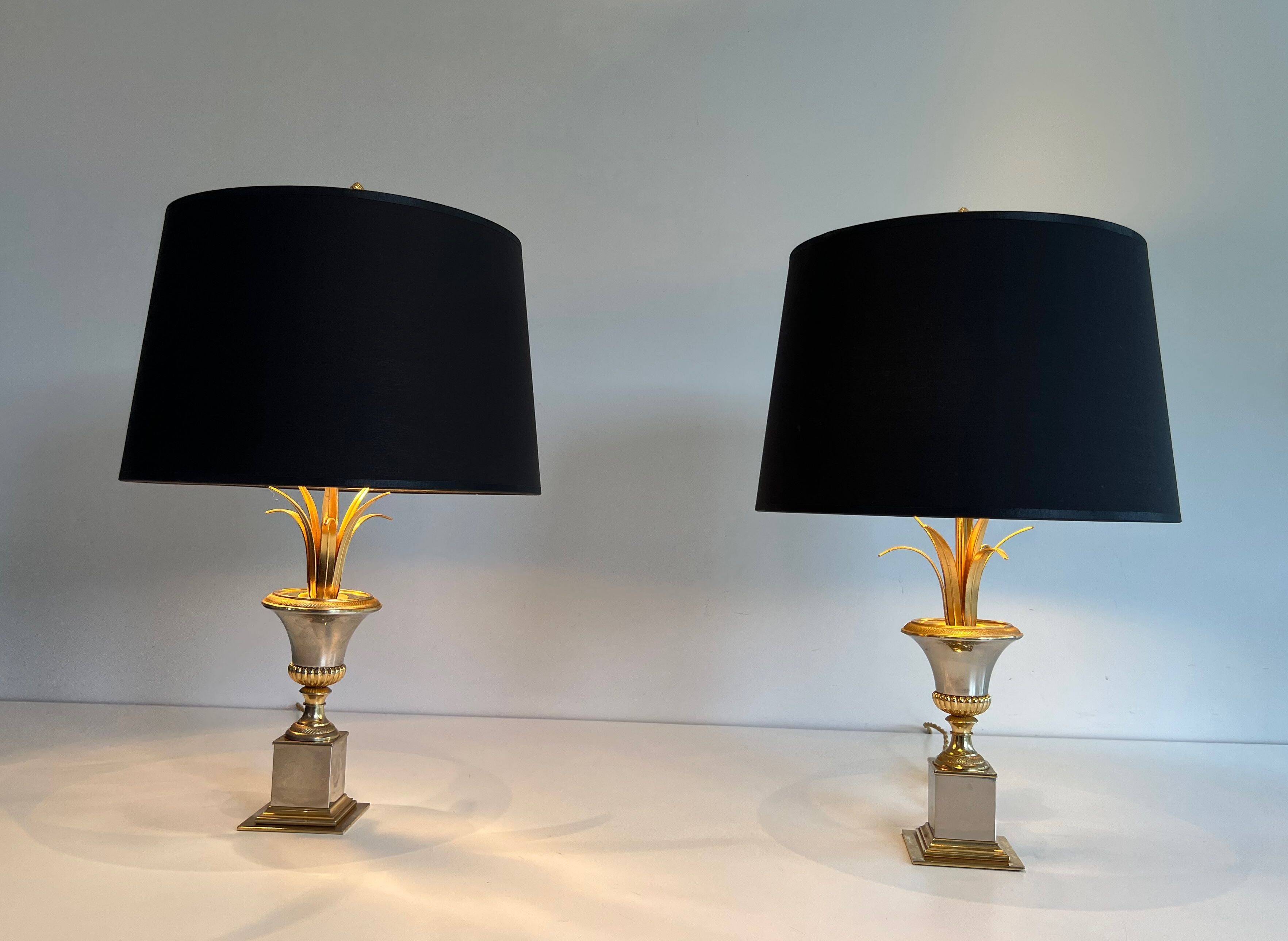 Pair of palm lamps in chrome and brass in the style of Maison Charles. Circa 1970.