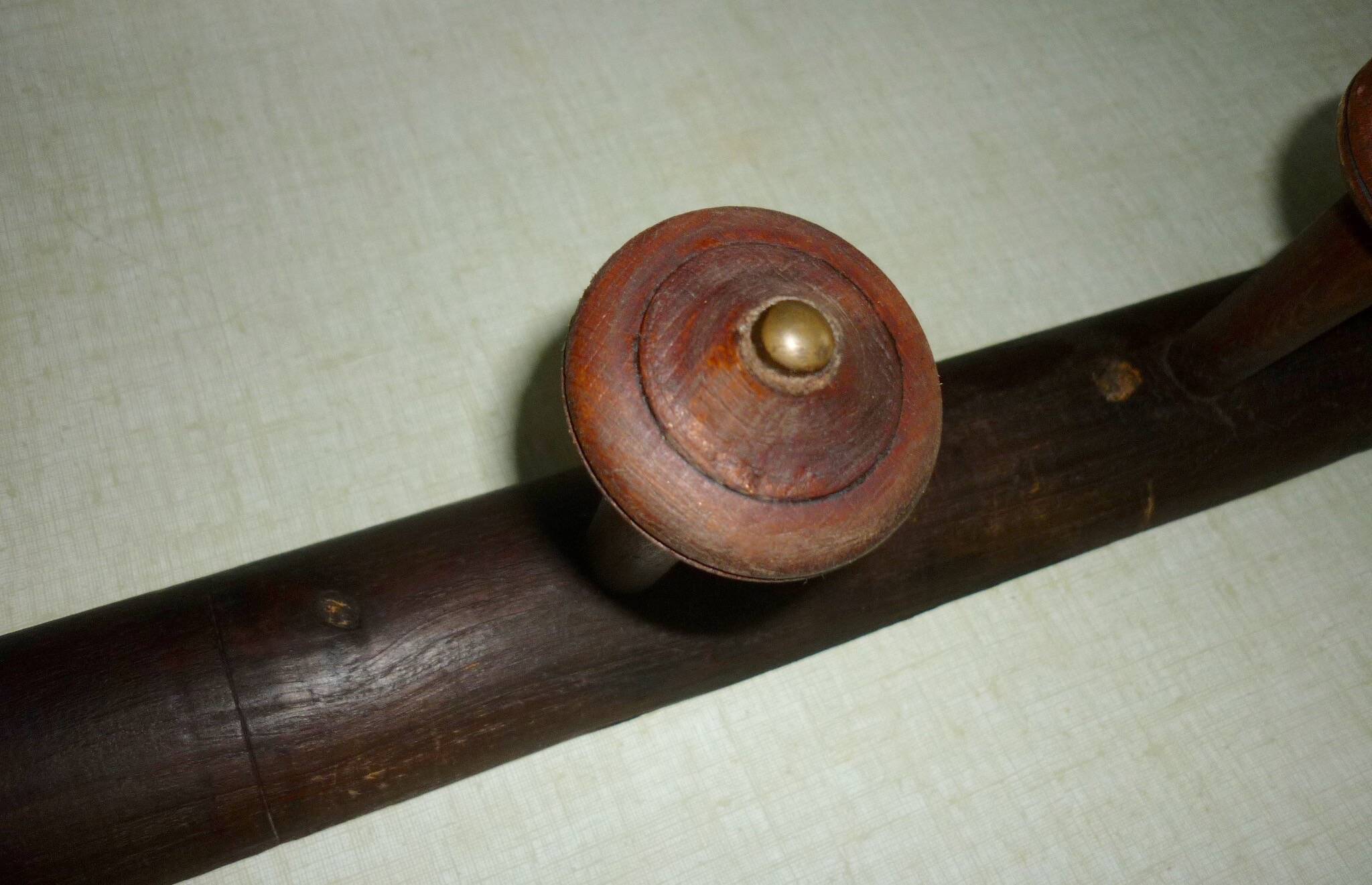 Wooden wall-mounted coat rack