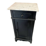 Chest of drawers with a white marble top.