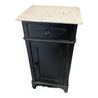 Chest of drawers with a white marble top.