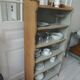 Small vintage bookcase, 5 fixed shelves, interior sublimated in verdigris, waxed finish.