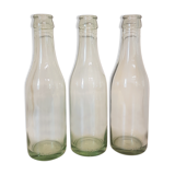 Suite of three old small glass bottles