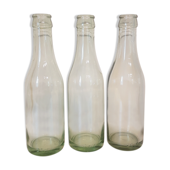 Suite of three old small glass bottles