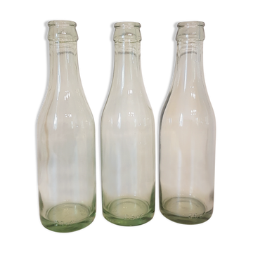 Suite of three old small glass bottles