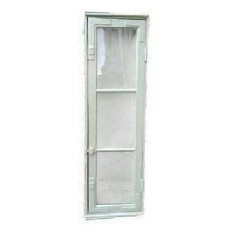 Old window mounted as a fenestron