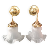 Brass and frosted glass wall lights