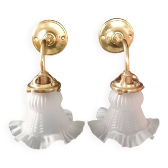 Brass and frosted glass wall lights