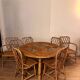 Round dining table Audoux Minet with 4 chairs and 2 armchairs.