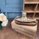 Vintage cat fish catchall in brass on a solid wood base.