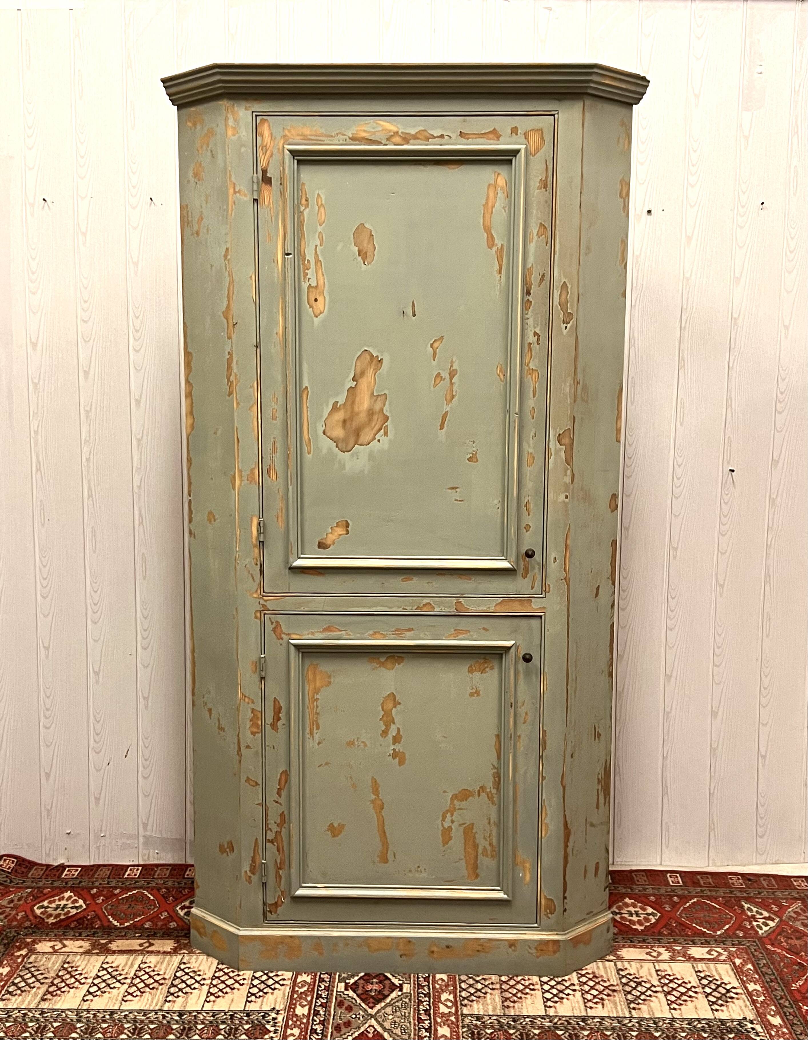 Patinated corner cupboard