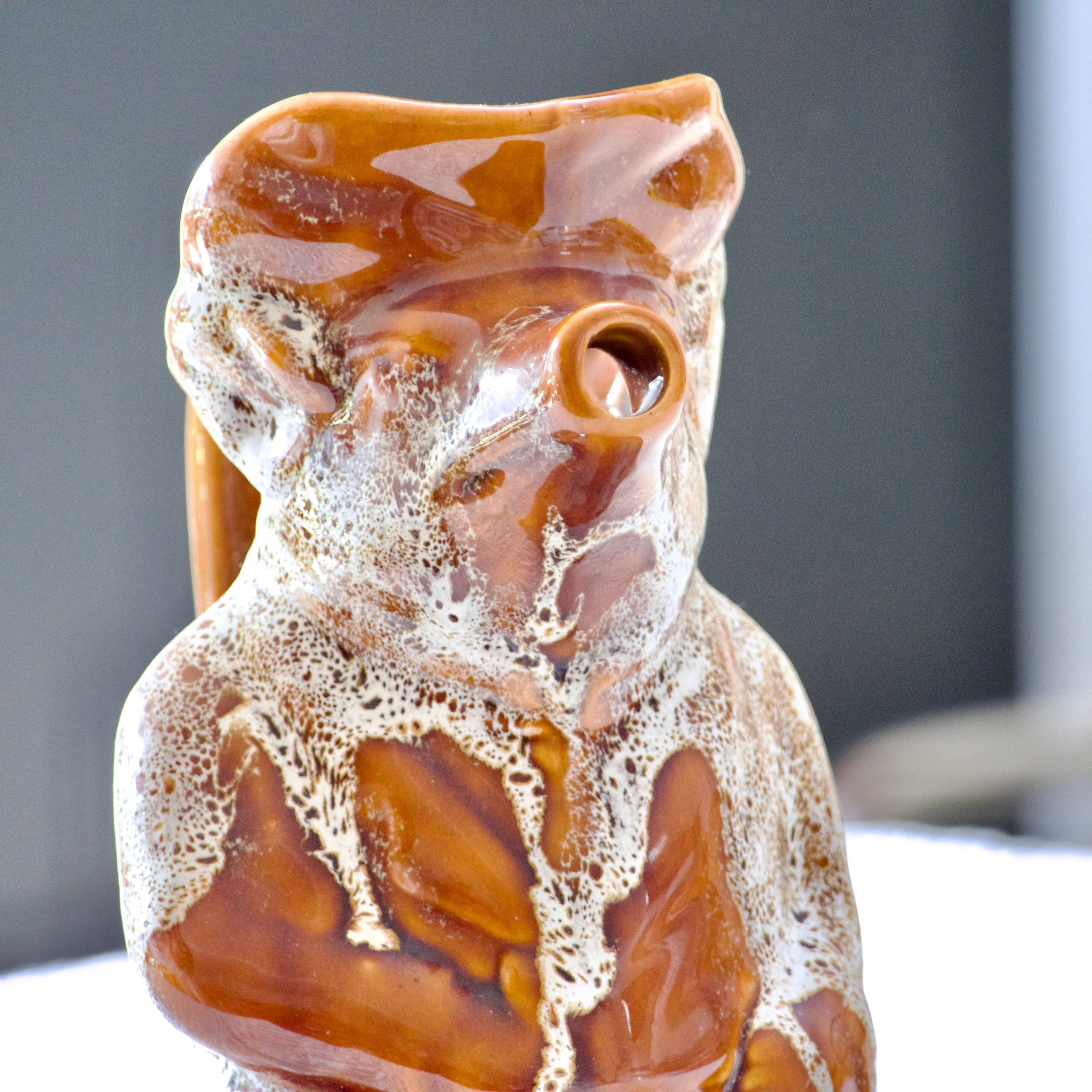 Antique zoomorphic pig carafe in foam-enameled stoneware