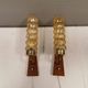 A set of Danish wall lights in champagne coloured glass with brass and teak.