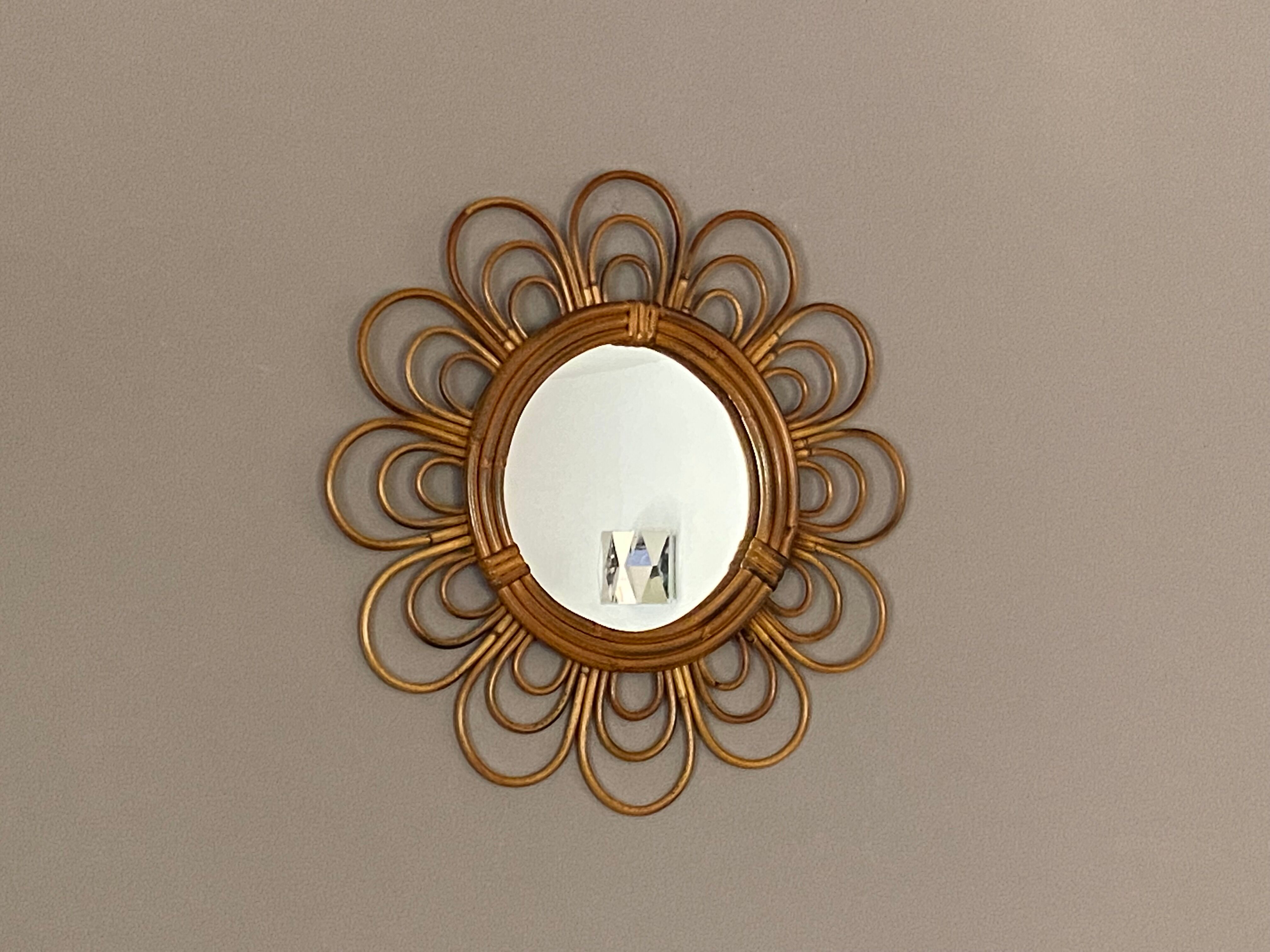 Sun mirror in arched rattan. 40cm. 1960.