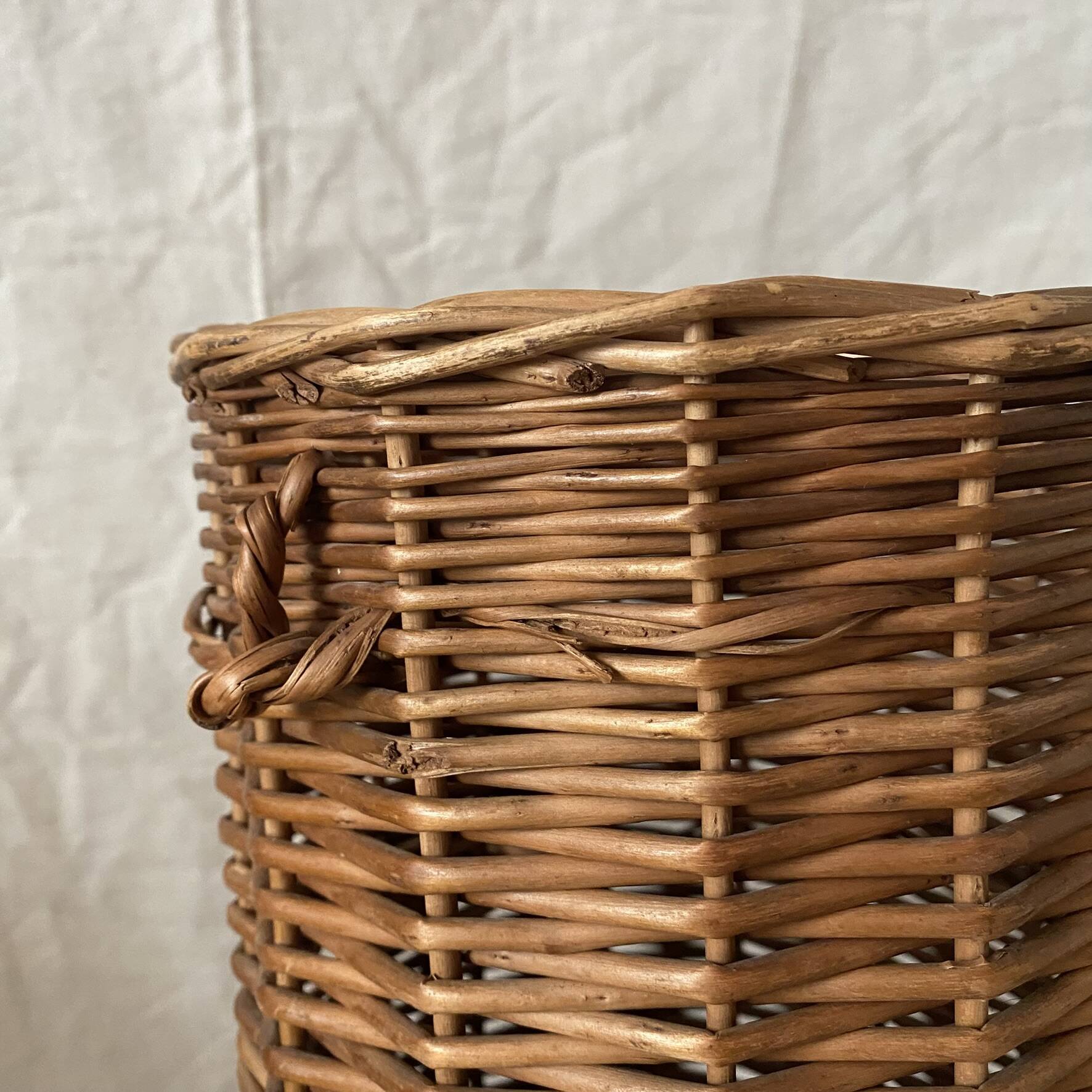 Woven wicker basket, vintage rod holder