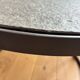 Round coffee table in natural stone and metal – contemporary design