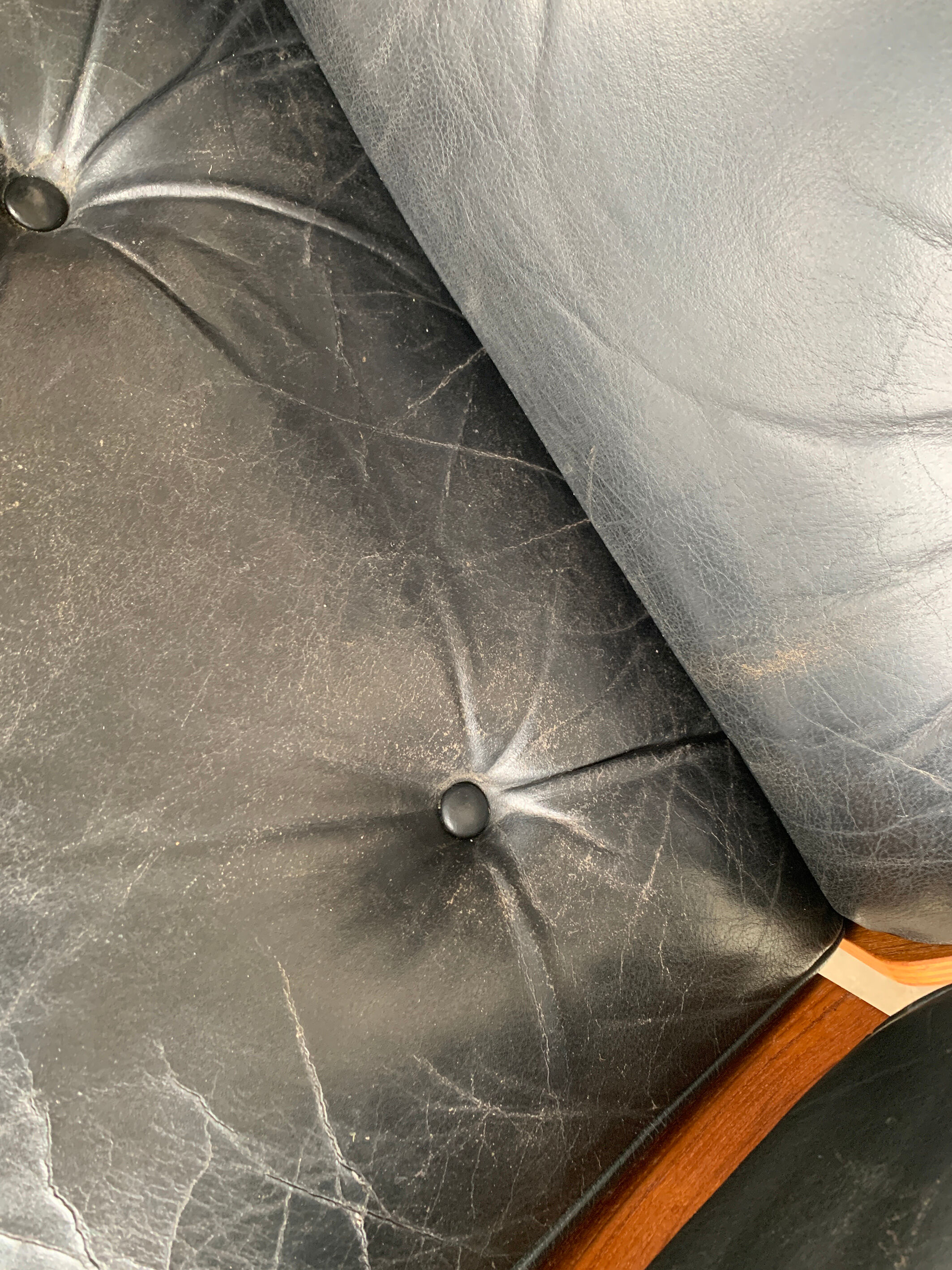 Lounge chair and ottoman black leather and teak multiplex, 1960
