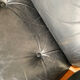 Lounge chair and ottoman black leather and teak multiplex, 1960