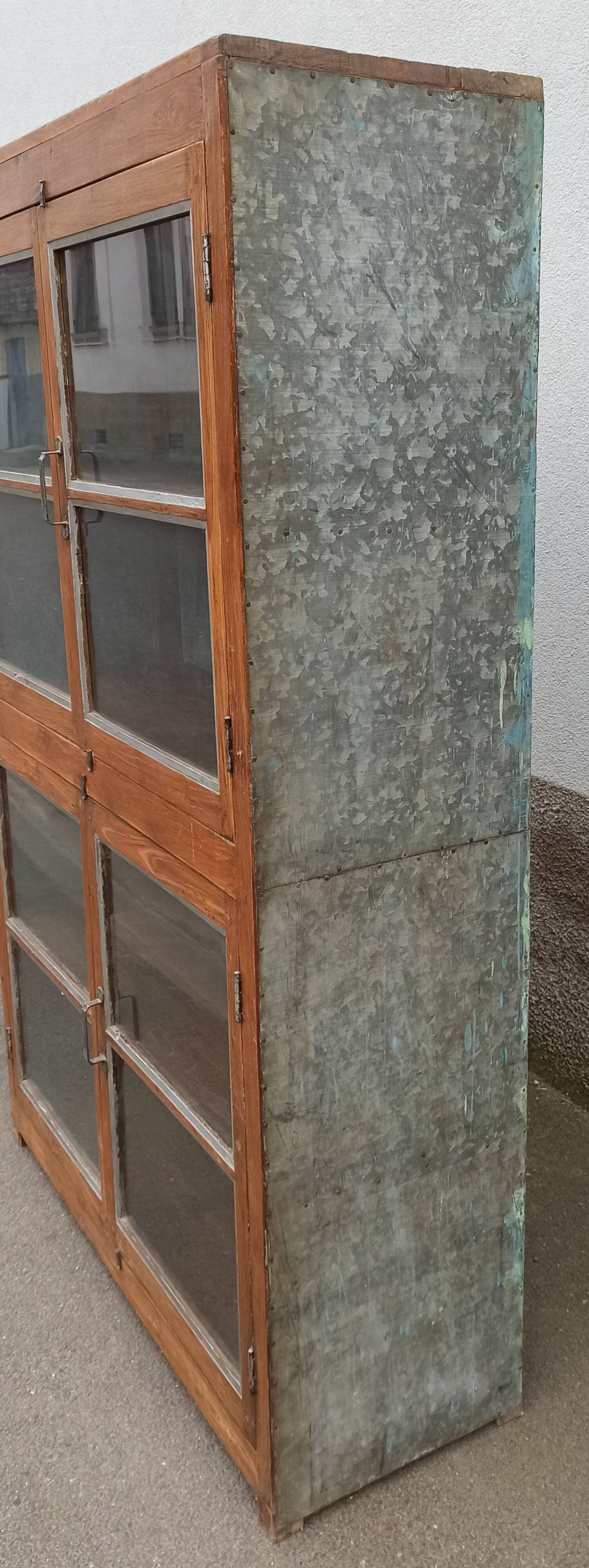 Old glass cabinet in wood and metal
