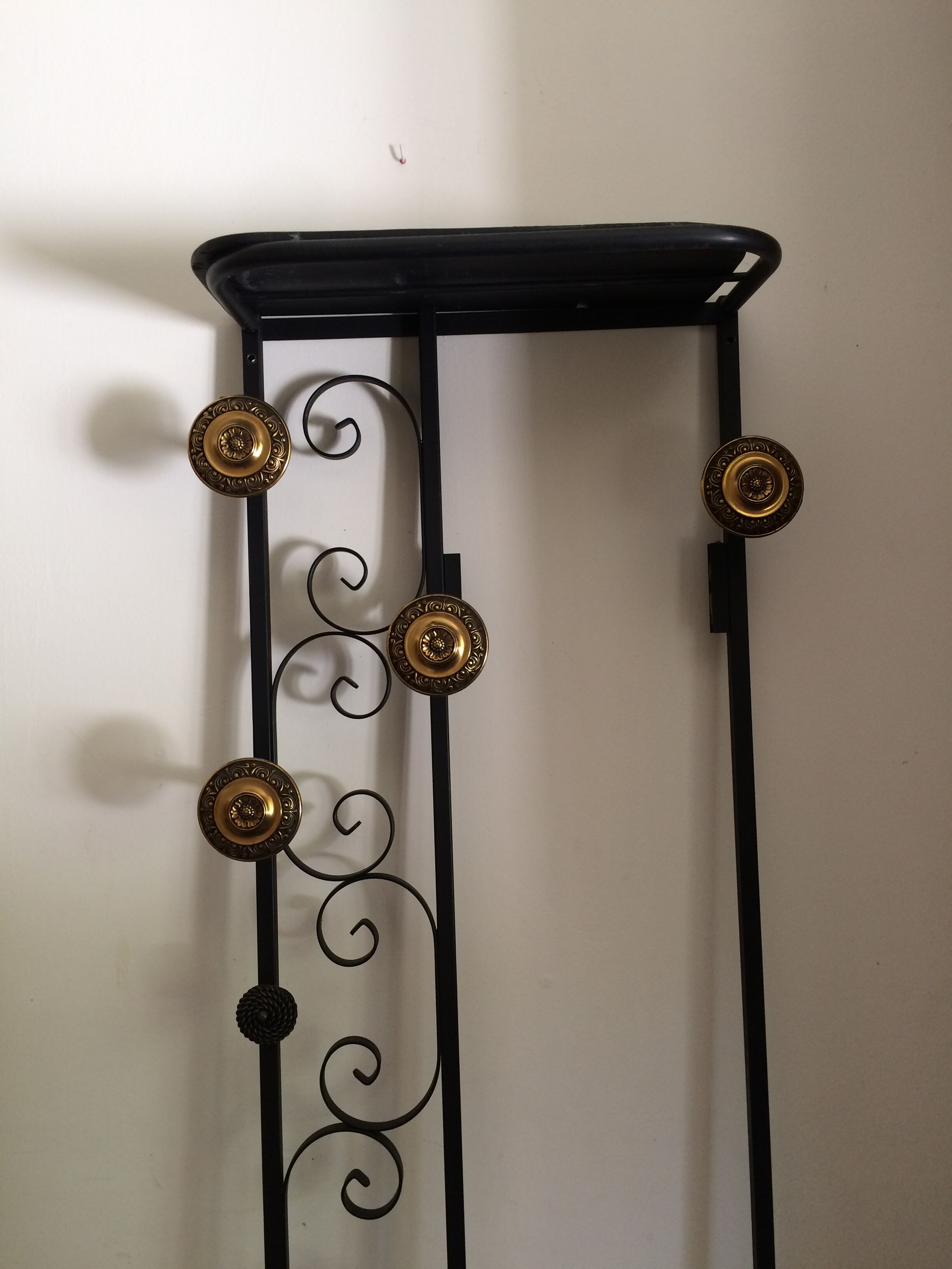 Coat hanger on wrought iron feet