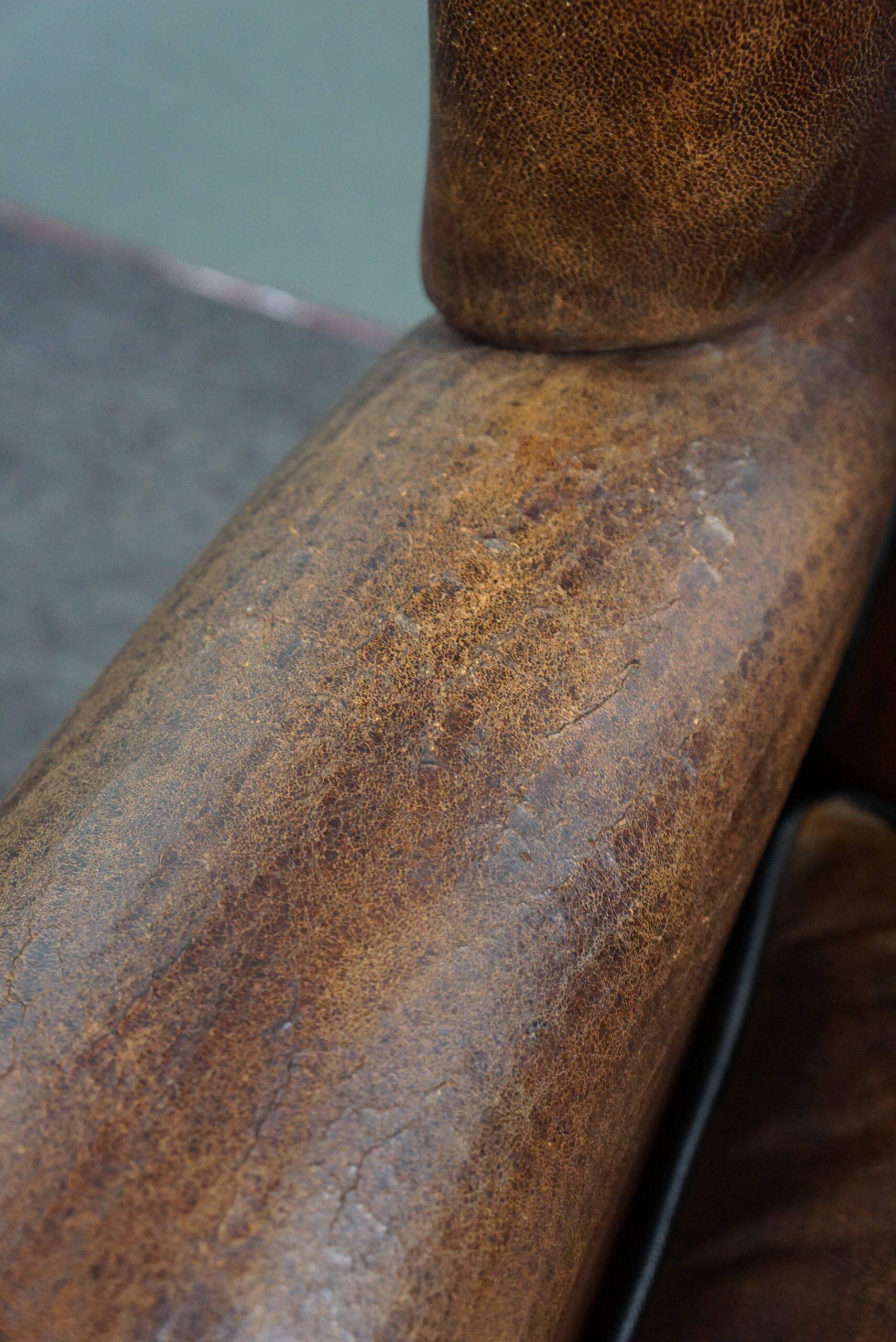 Fauteuil à oreilles en cuir de mouton