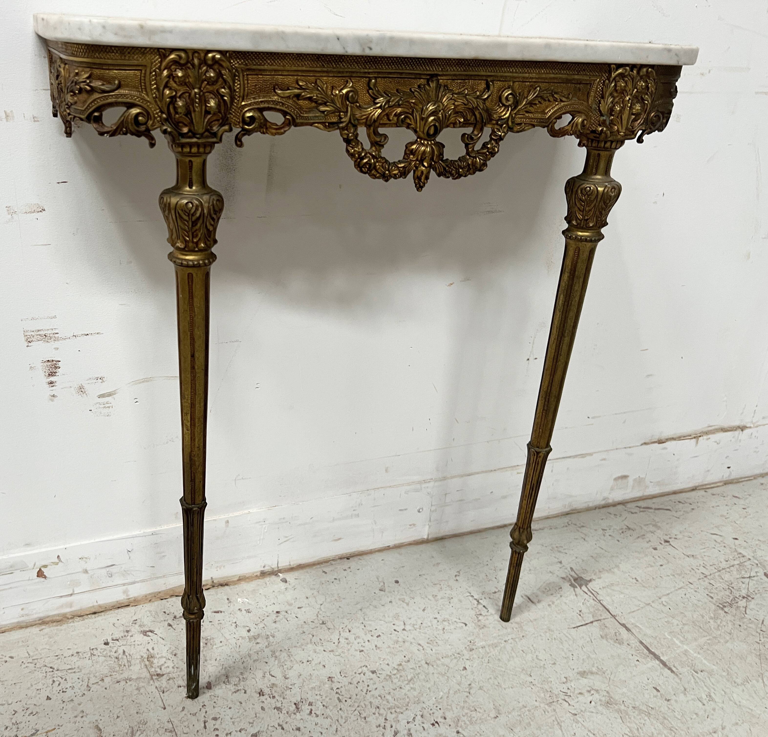 Louis XVI style console in chiselled bronze, 20th century.
