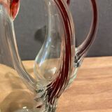 pair of crystal buires, handles with red tinted net decoration in the mass