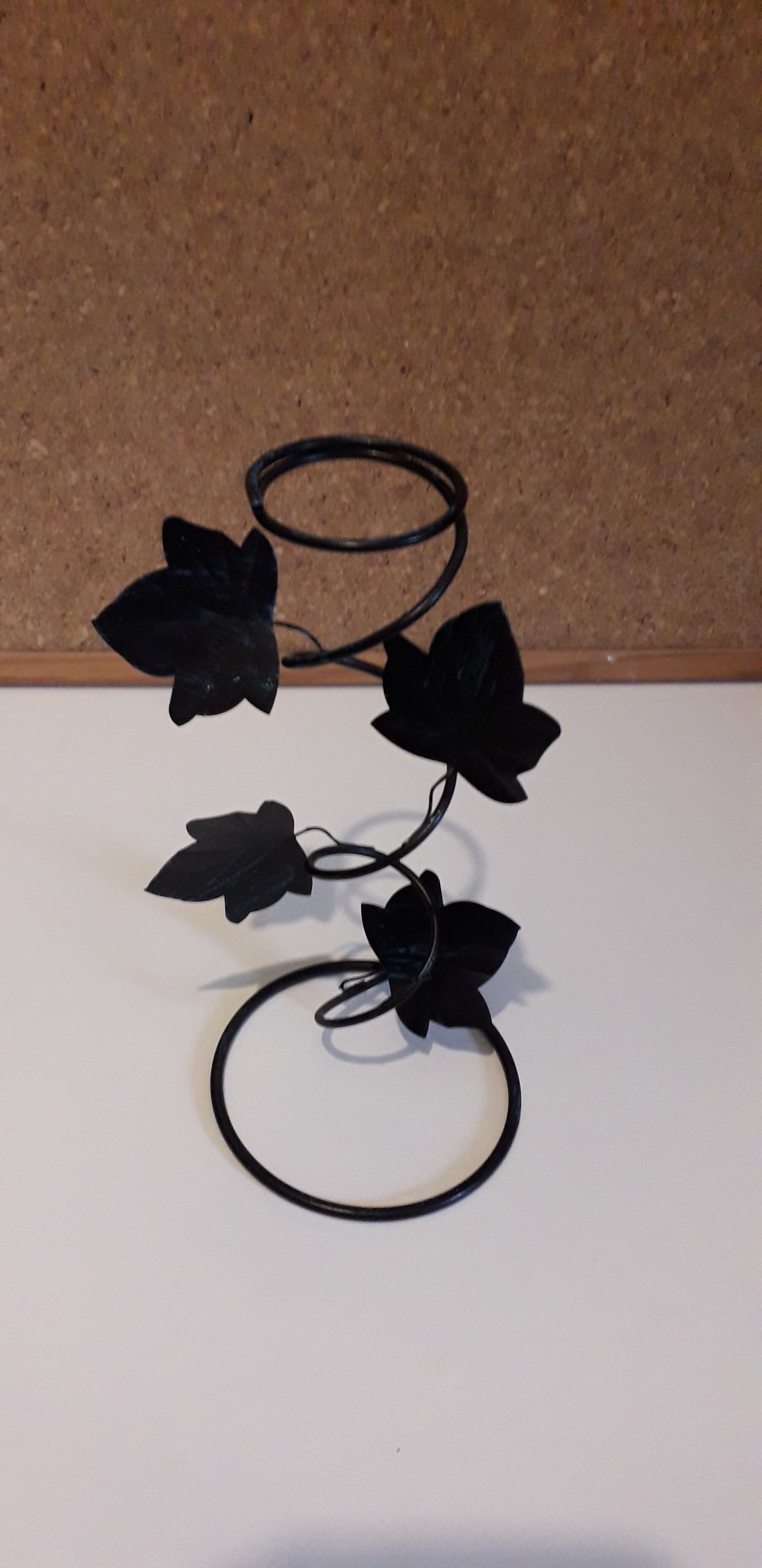 Glass soliflore vase in the shape of a fleur-de-lis on metal base