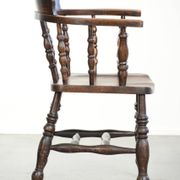 Wooden English antique pub/captain chair from the late 19th century