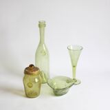 Biot bubble glass ensemble, bottle, jar, bowl and glass.