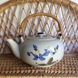 Vintage teapot with rattan handle