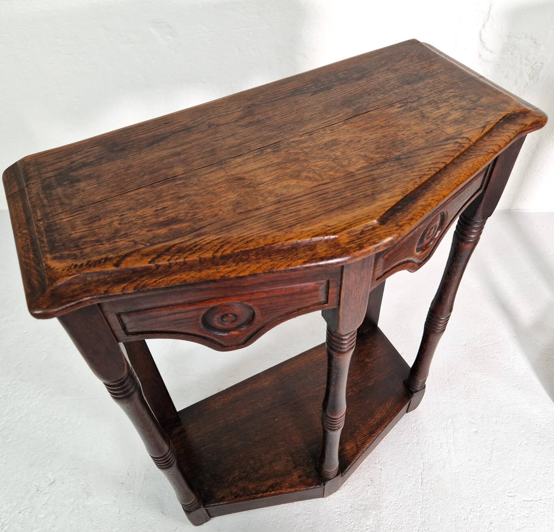 Pair of English 1920s carved oak sidetables
