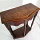 Pair of English 1920s carved oak sidetables