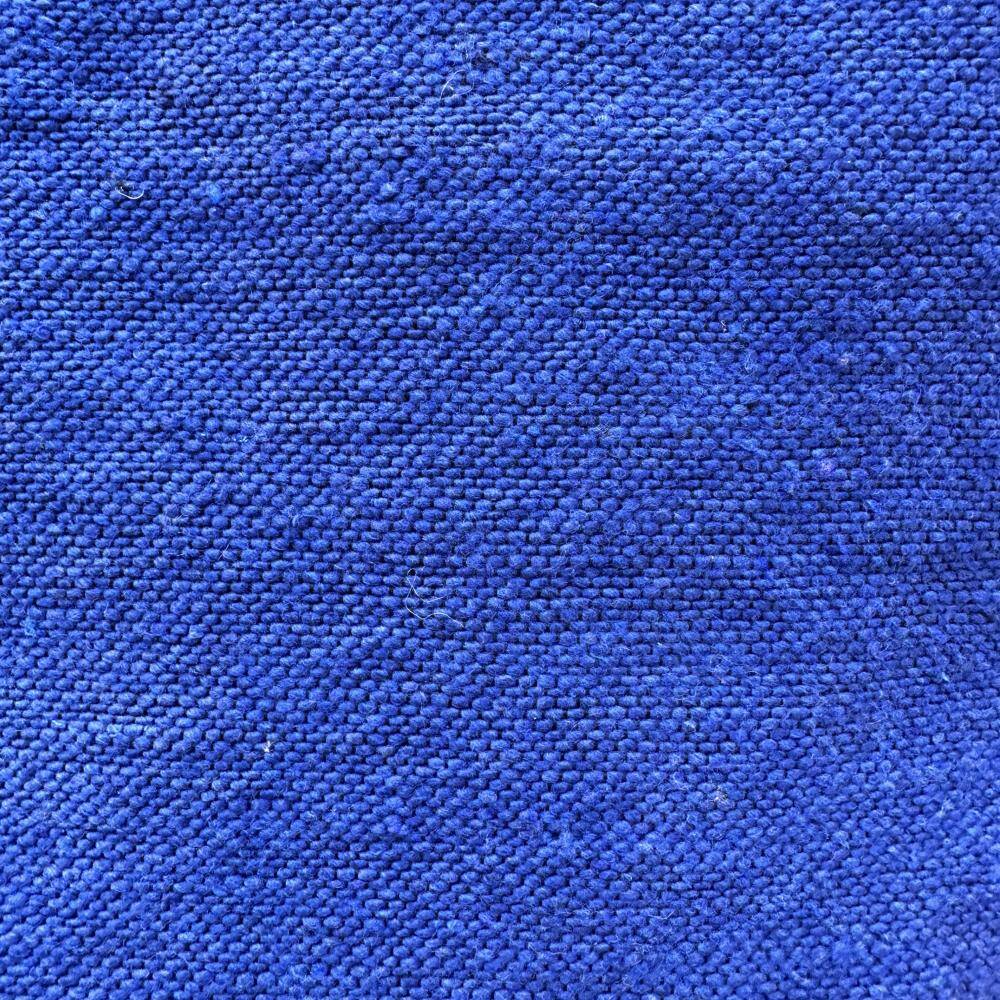 Blue plaid with Moroccan pompoms