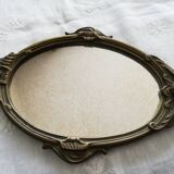 Old hand-facing mirror in gilded bronze
