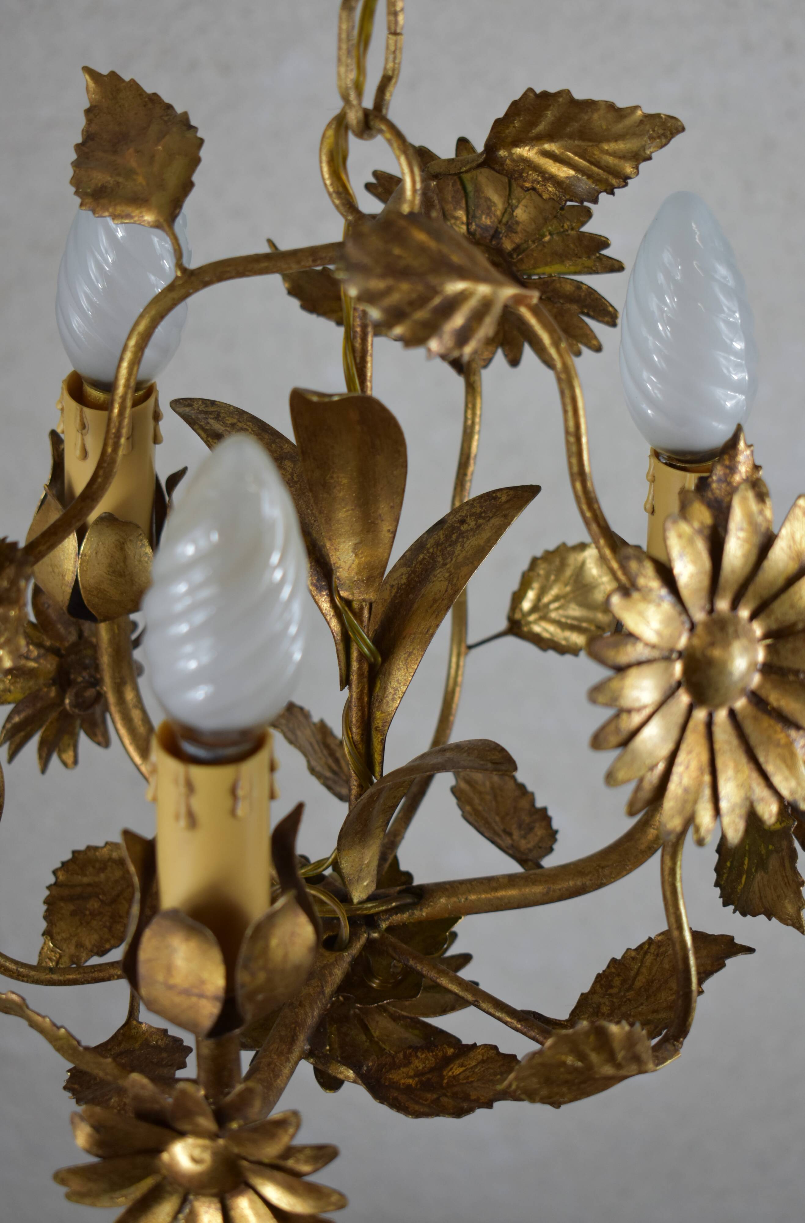 golden chandeliers with flowers.